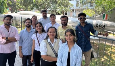 Students posing beside a decommissioned Indian Air Force aircraft at the Visvesvaraya Industrial & Technological Museum — a powerful reminder of India's aviation heritage.